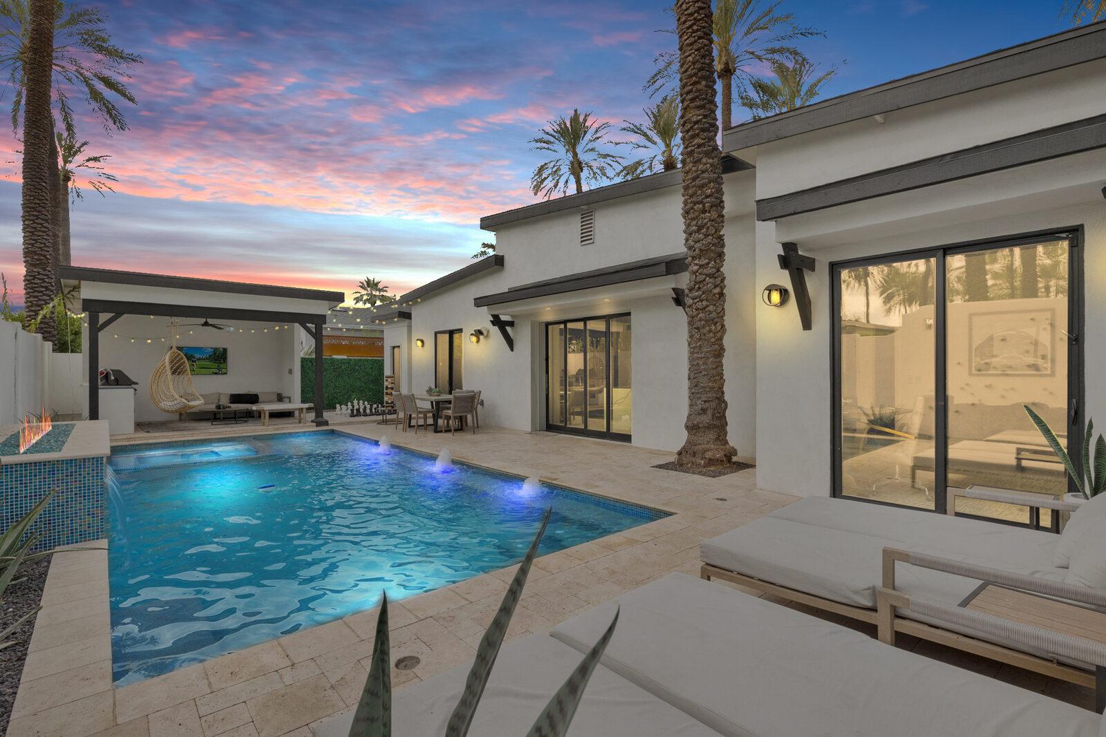 The pool with its Baja shelf at Palmera, a design-led Phoenix home on a street lined with date palms.