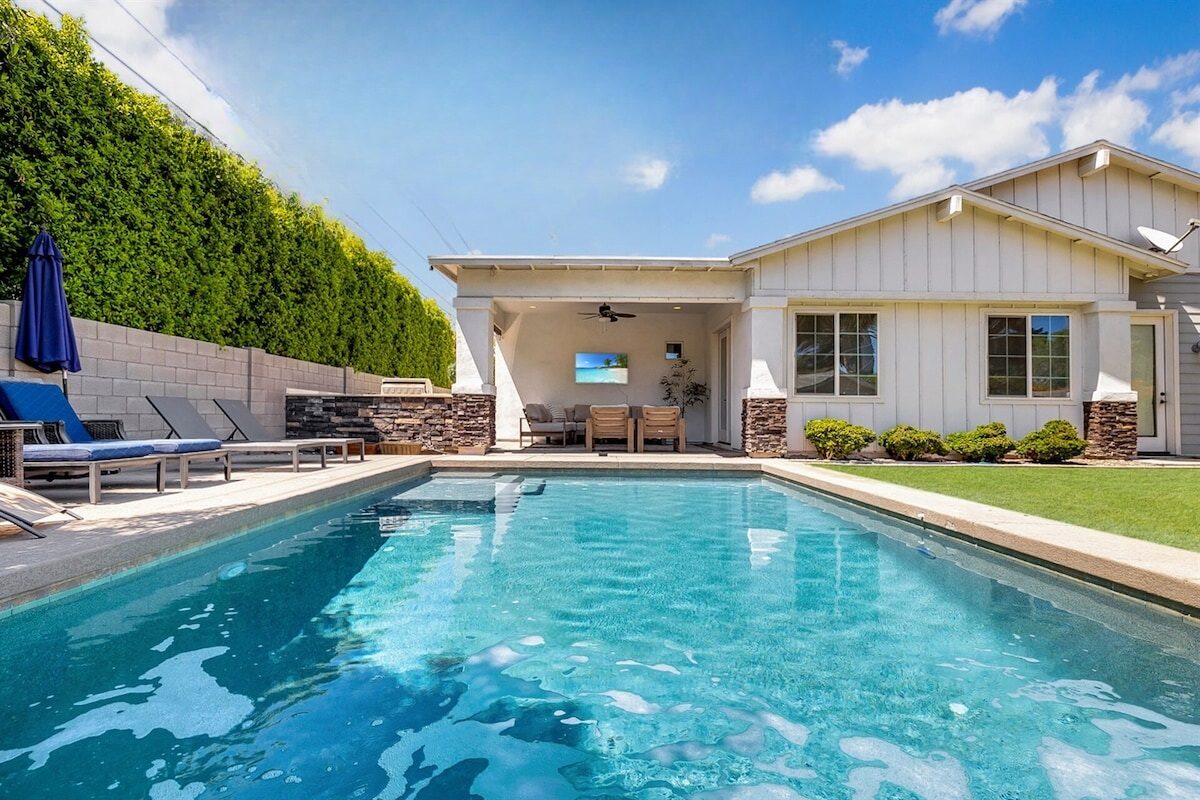 The open living space and chef's kitchen at The Grove, a four-bedroom gather-house in the Arcadia citrus corridor.